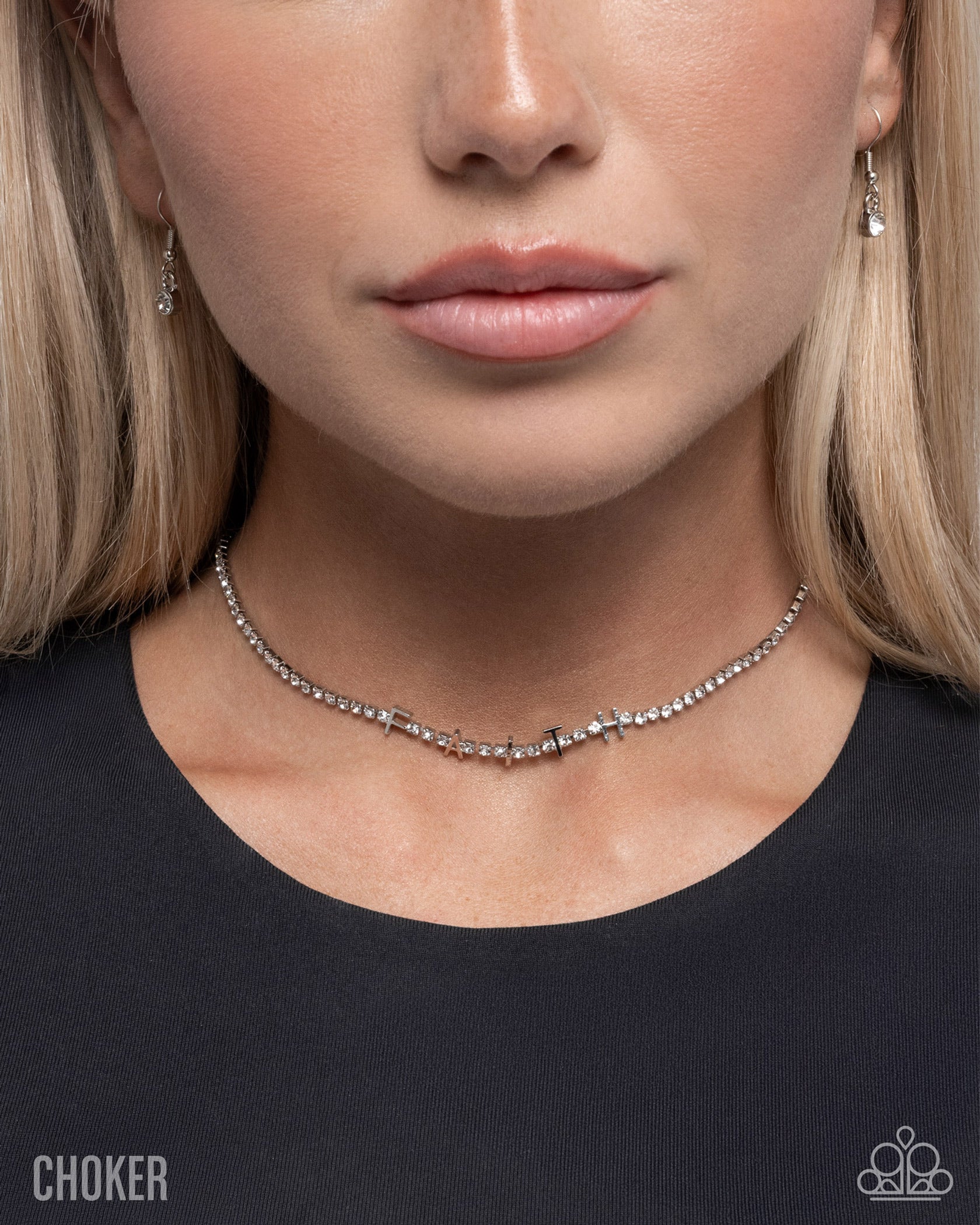 Close-up of a woman wearing a choker necklace with a plain background