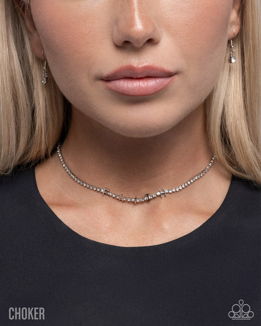 Close-up of a woman wearing a choker necklace with a plain background