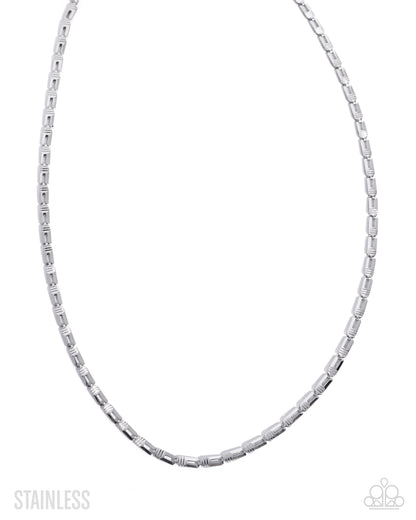 Silver chain necklace on a white background