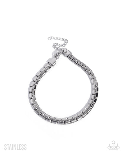 Silver chain bracelet on a white background