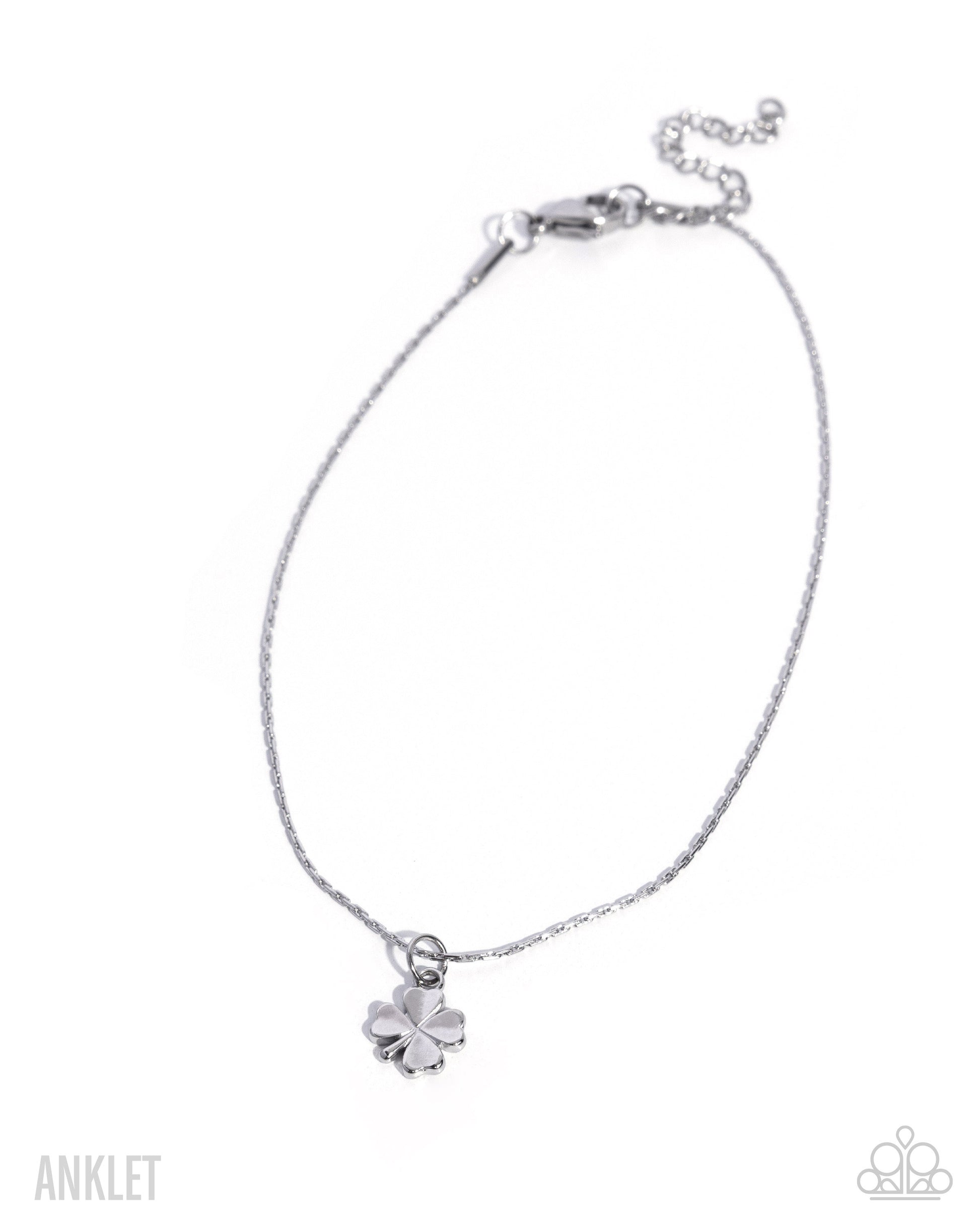 Silver anklet with a clover charm on a white background