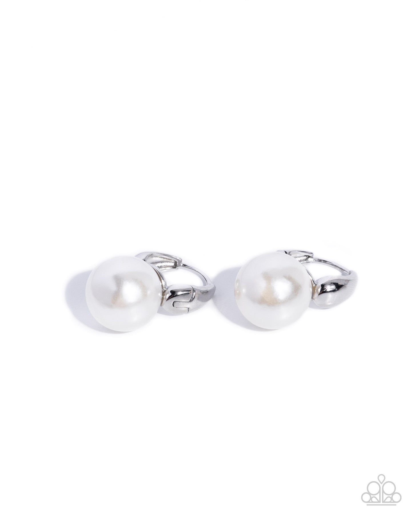 Pair of silver cufflinks with pearls on a white background