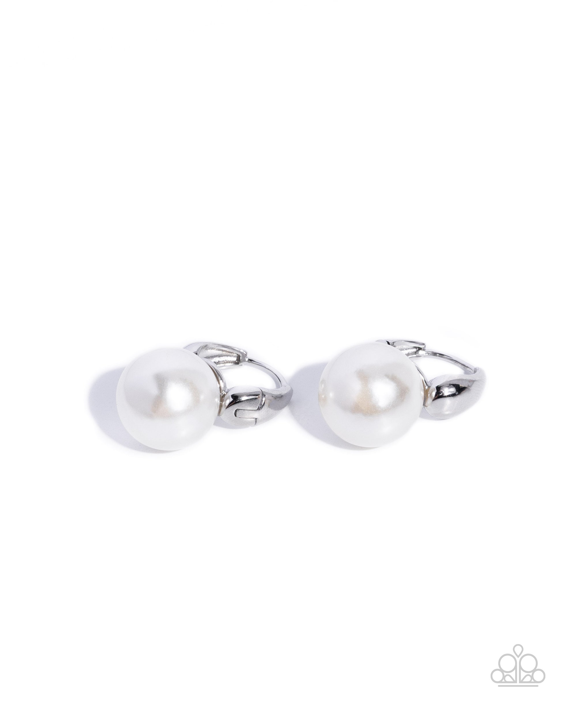 Pair of silver cufflinks with pearls on a white background