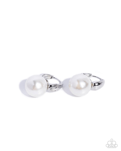 Pair of silver cufflinks with pearls on a white background