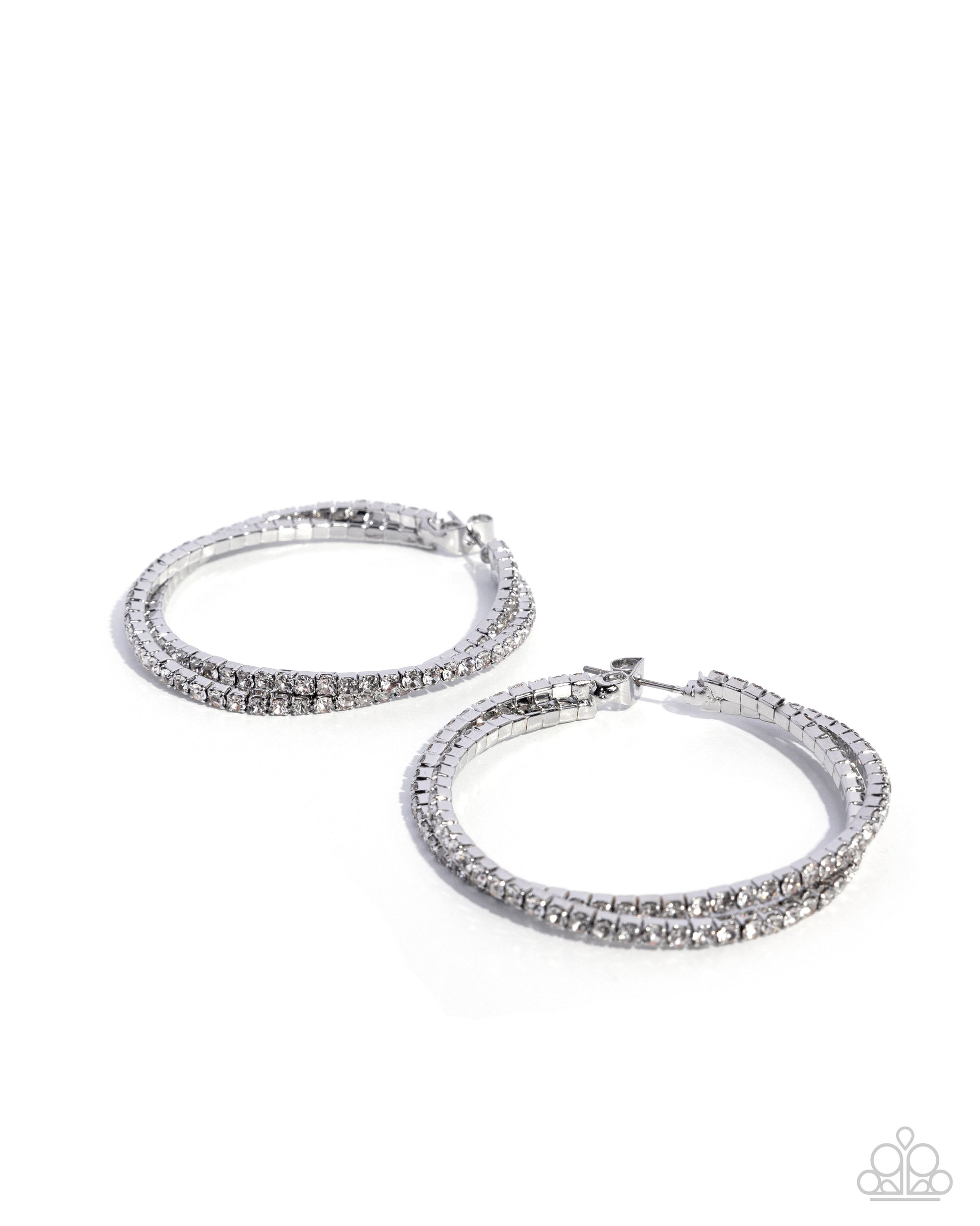 Pair of silver hoop earrings with clear gemstones on a white background