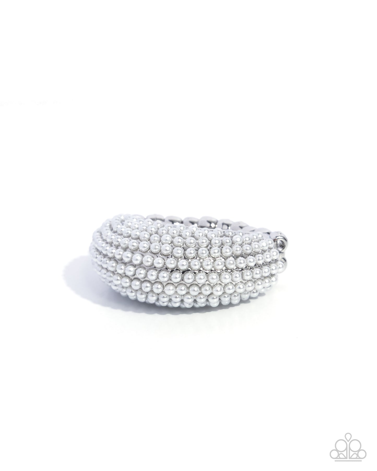 Stack of silver bangles on a white background