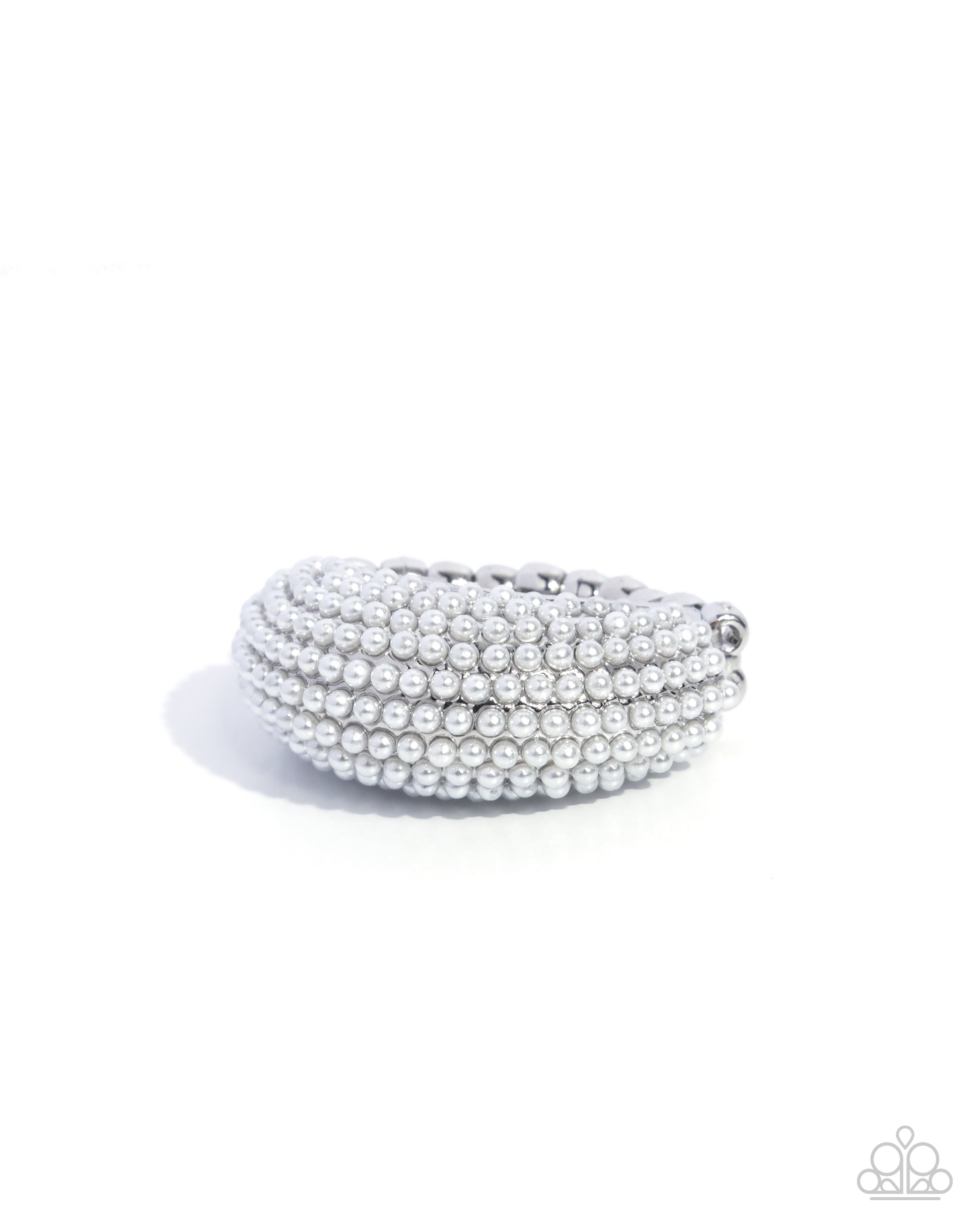 Stack of silver bangles on a white background