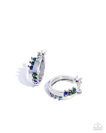 Silver hoop earrings with green and blue gemstones on a white background