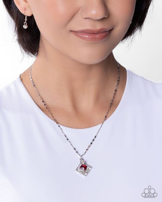 Necklace with a red heart pendant worn by a model on a white background