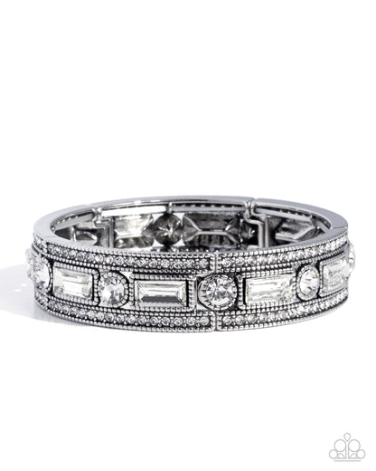 Silver ring with gemstones on a white background