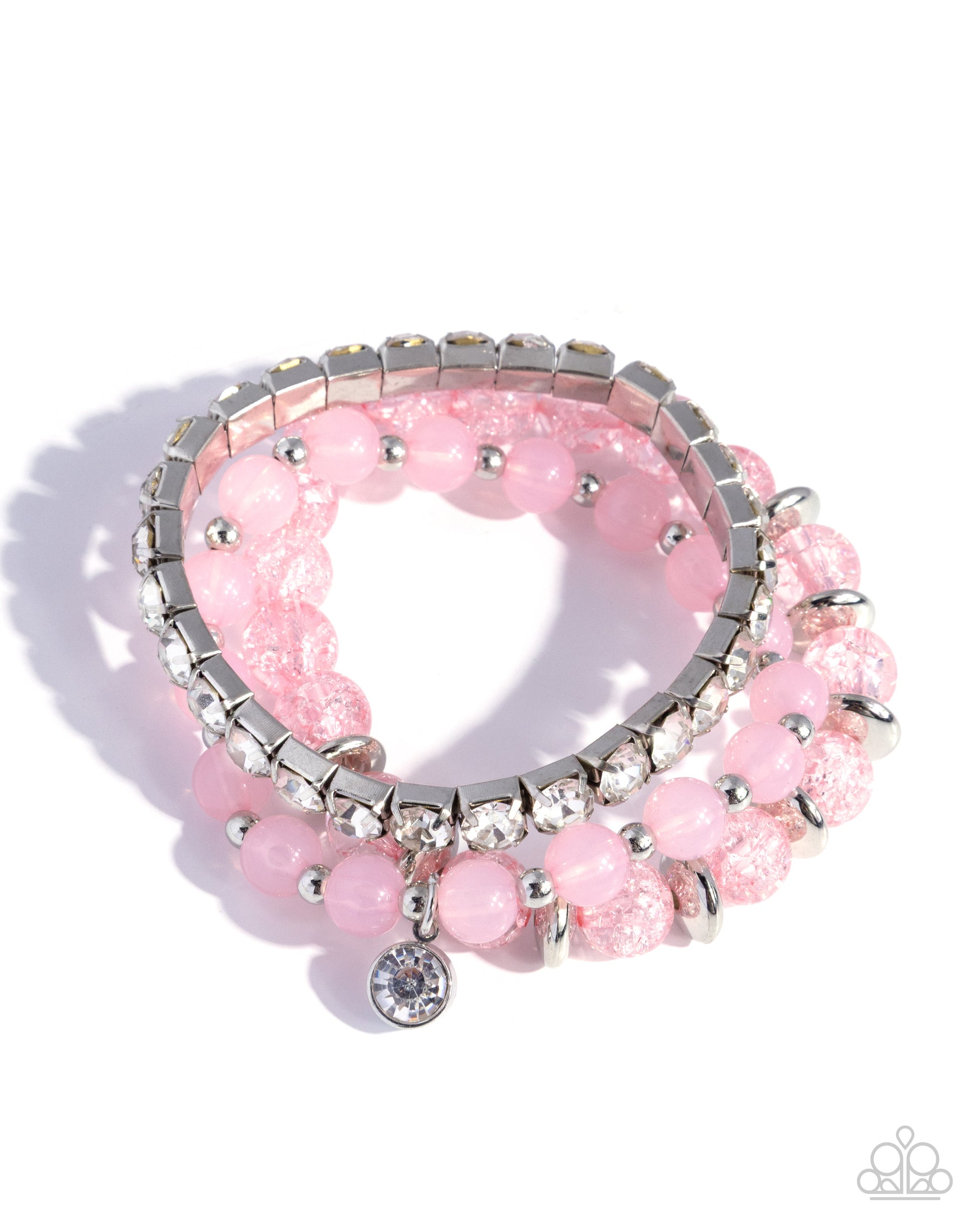 Pink beaded bracelet with silver accents on a white background