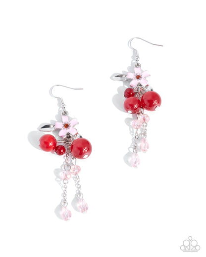 Pair of earrings with red beads and pink flowers on a white background