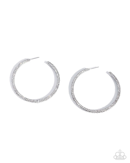 Pair of silver hoop earrings on a white background