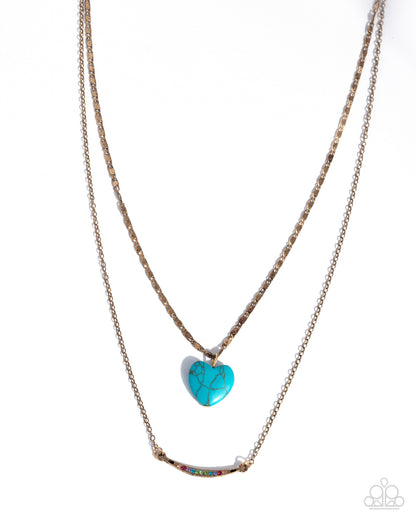 Necklace with turquoise heart pendant on a white background