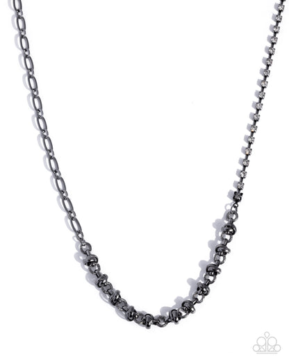 Black beaded necklace on a white background