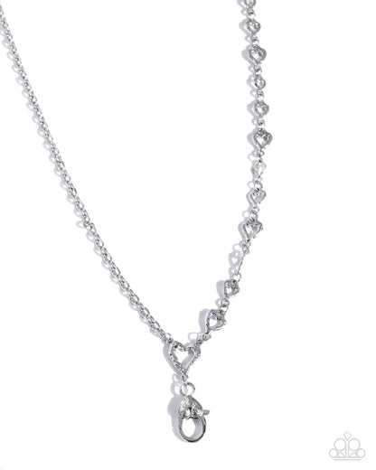 Silver necklace with heart-shaped links on a white background