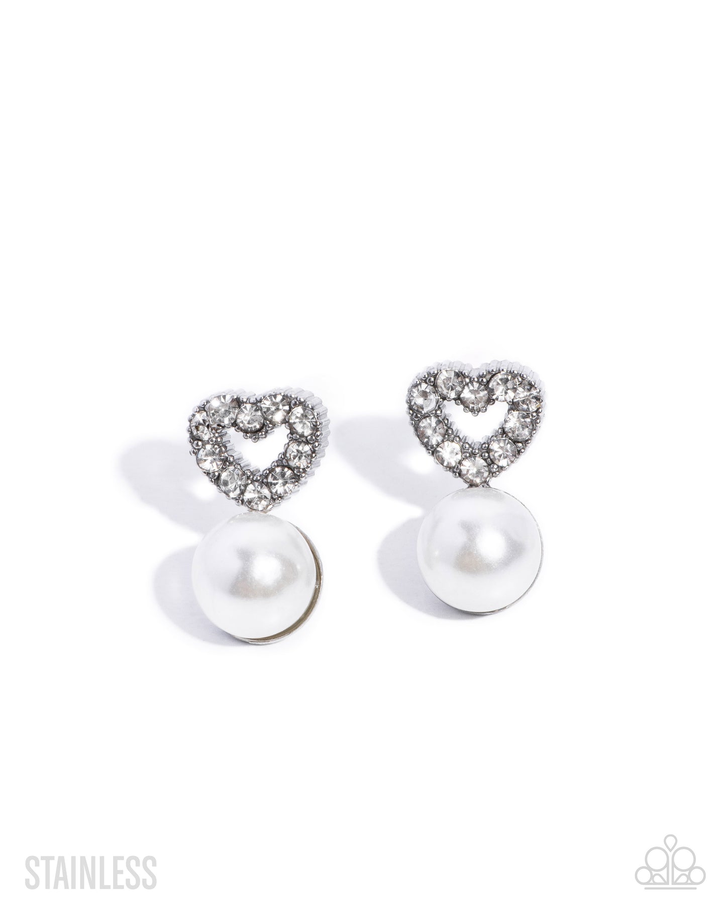 A pair of heart-shaped stud earrings featuring a silver-tone stainless steel heart pavé set with clear stones and a dangling white pearl drop, shown on a white background with a 'STAINLESS' text overlay.
