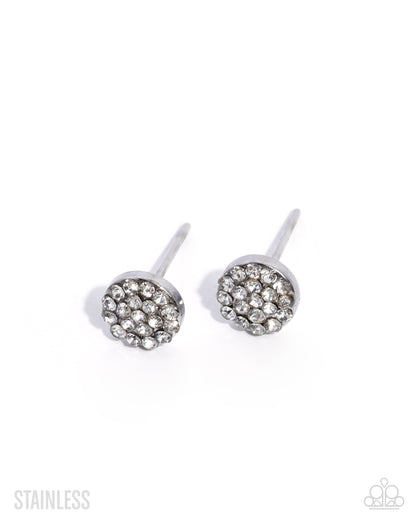 Pair of silver stud earrings with clear gemstones on a white background