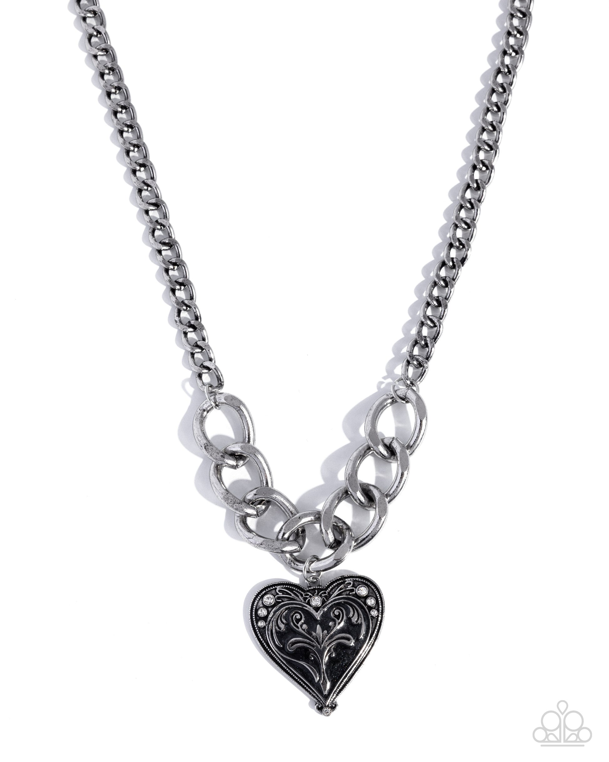 Silver chain necklace with a heart-shaped pendant on a white background