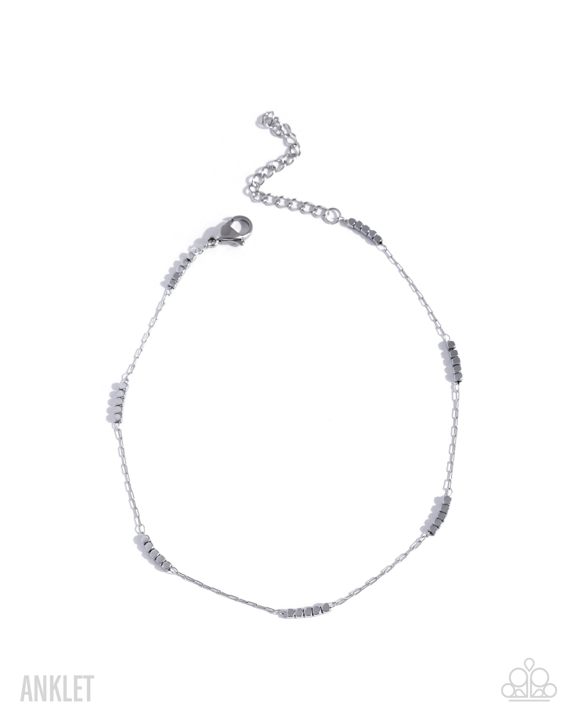 Silver anklet with small beads on a white background
