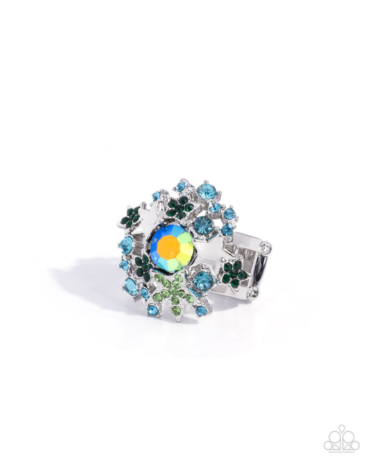 Decorative ring with colorful gemstones on a white background
