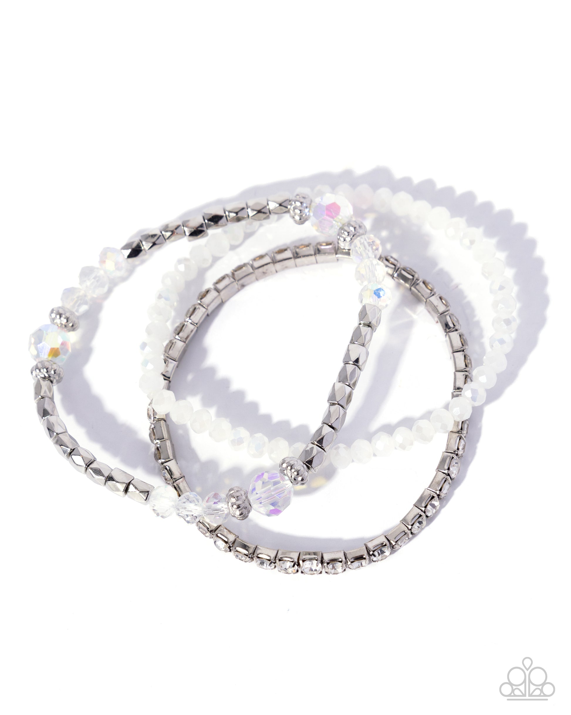 Set of beaded bracelets with silver accents on a white background