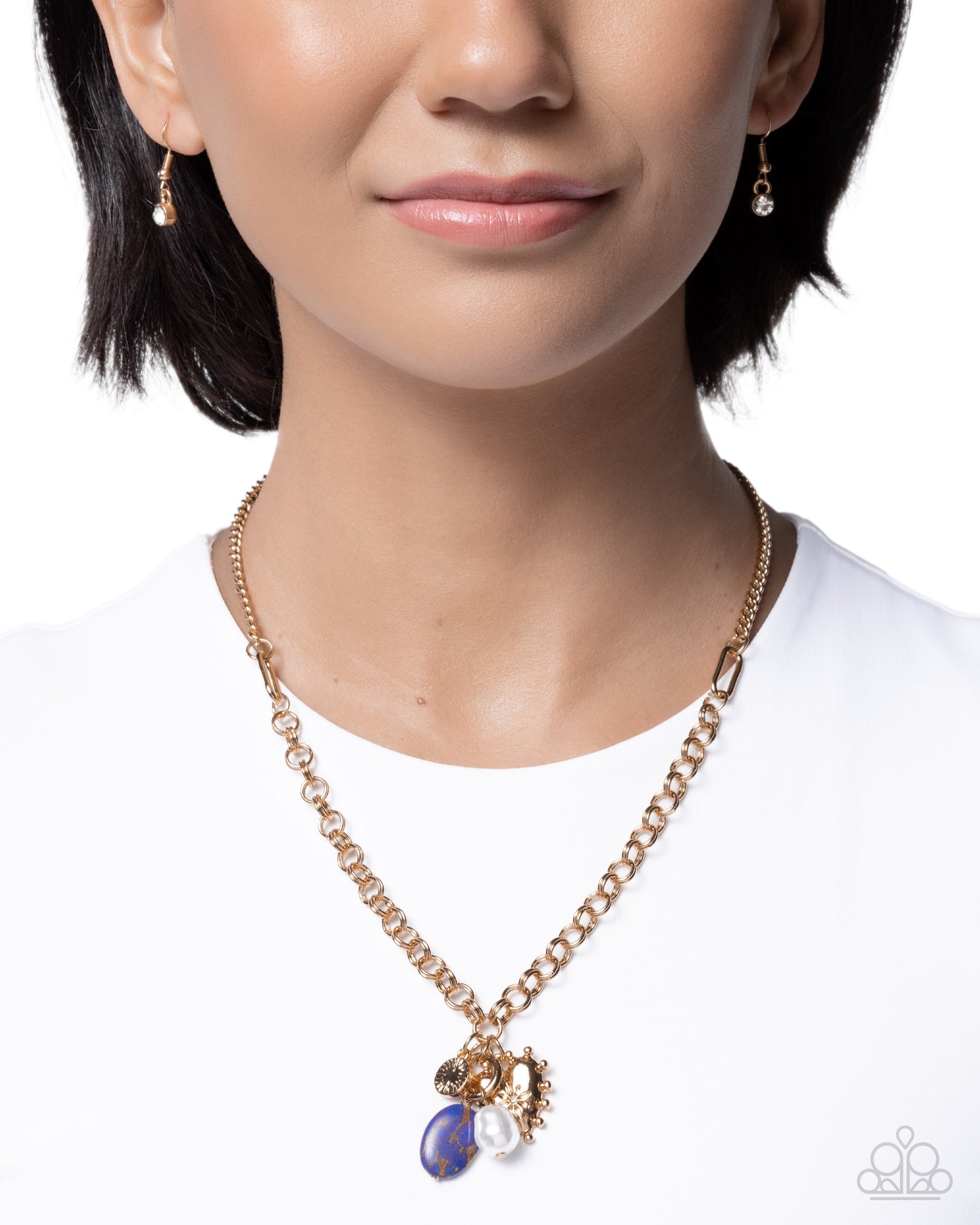 Necklace with blue pendant worn by a model on a white background