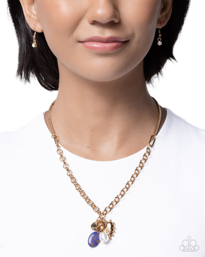 Necklace with blue pendant worn by a model on a white background