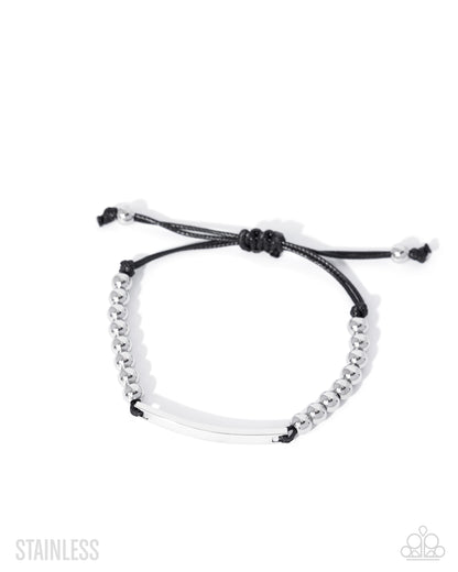 Black and white beaded bracelet on a white background