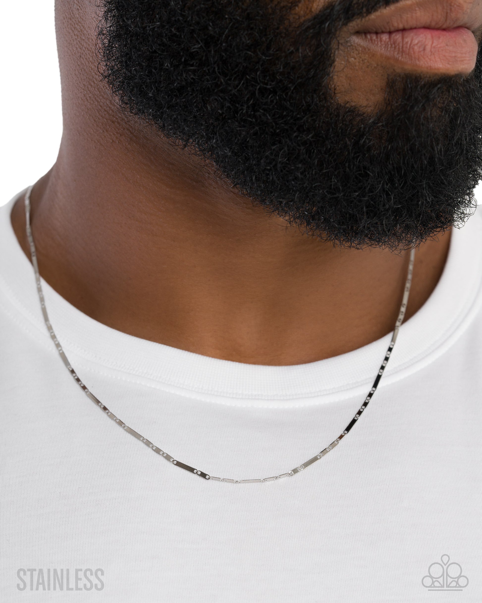 Man wearing a silver chain necklace on a white background