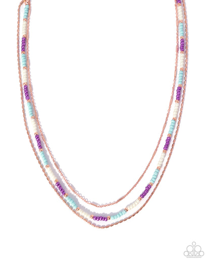 Multicolored beaded necklace on a white background