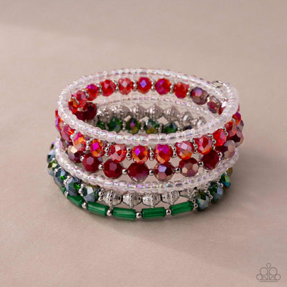 Stack of colorful beaded bracelets on a beige background