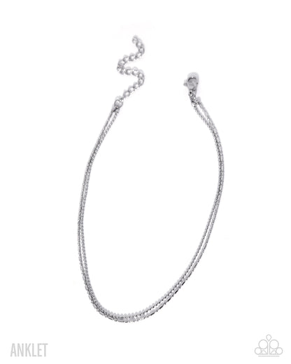 Silver anklet on a white background