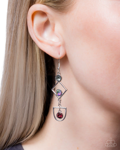 Earring worn on an ear with a plain background