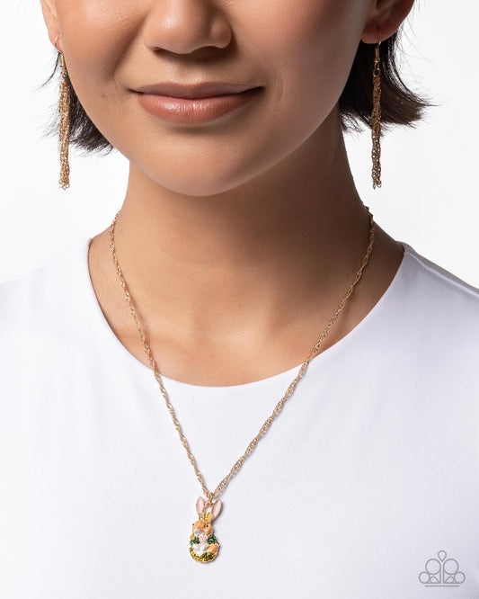 Necklace with pendant worn by a person on a white background