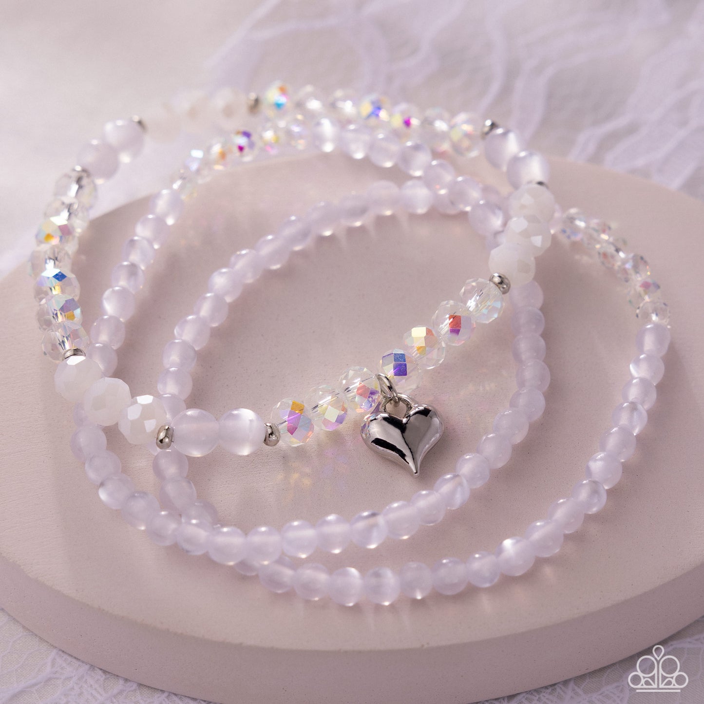 Necklace with heart-shaped pendant on a white surface