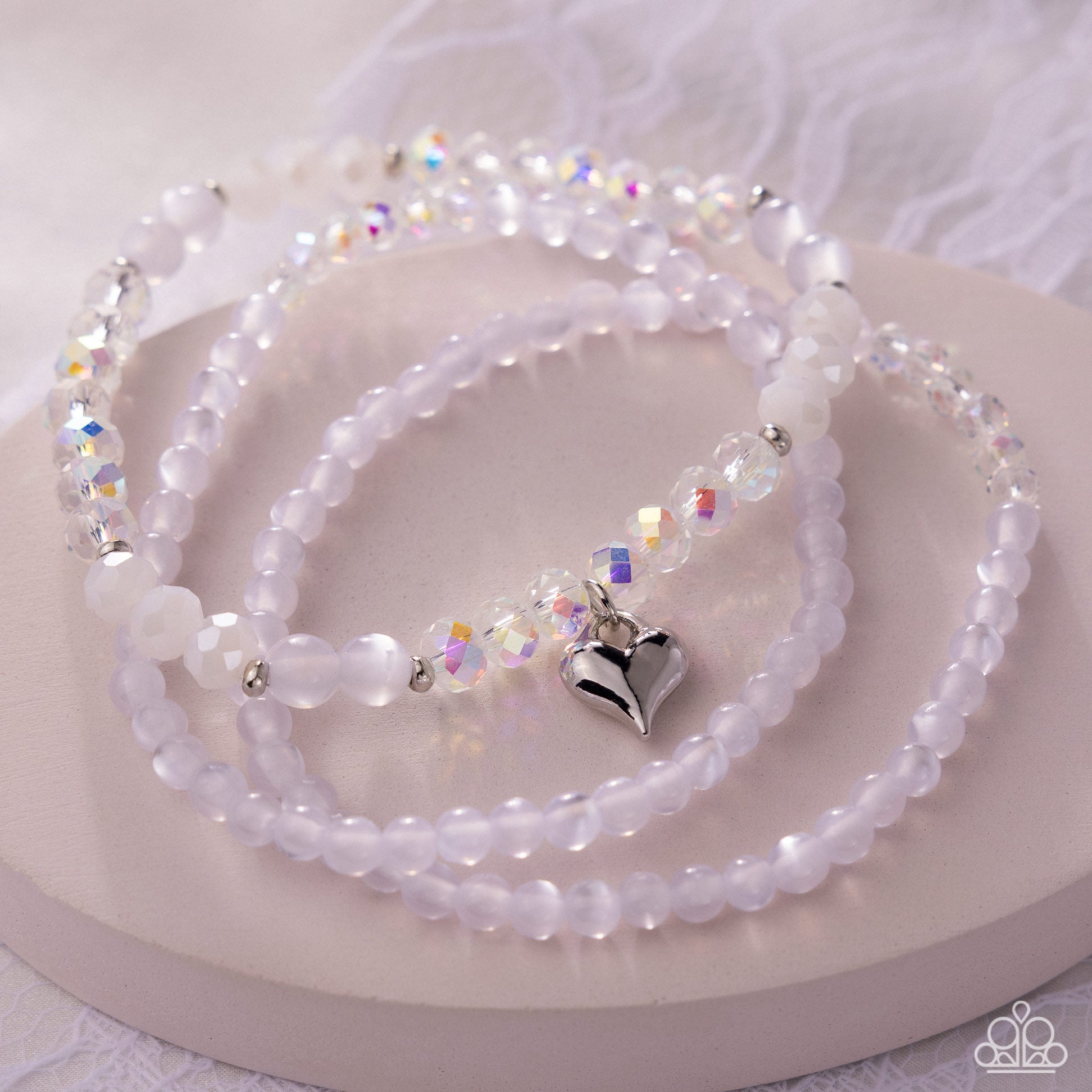 Necklace with heart-shaped pendant on a white surface