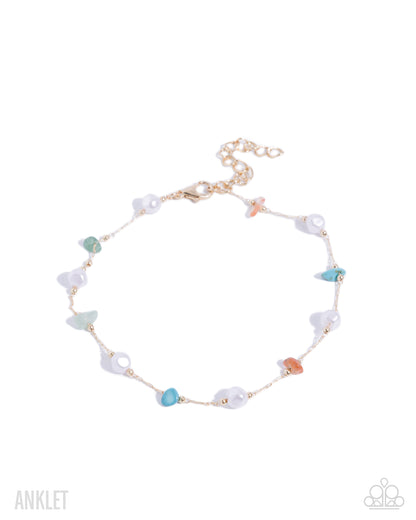 Multicolored beaded anklet on a white background