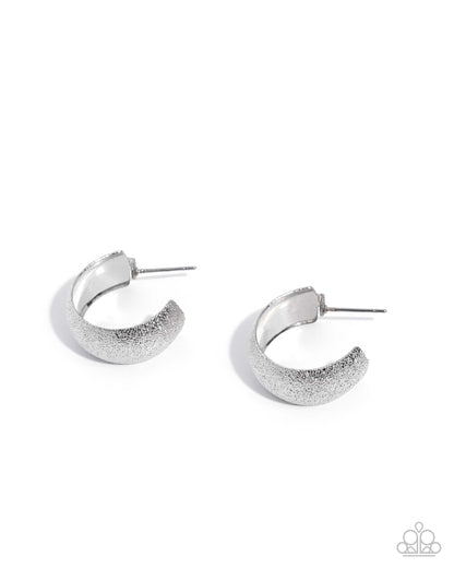 Silver hoop earrings on a white background