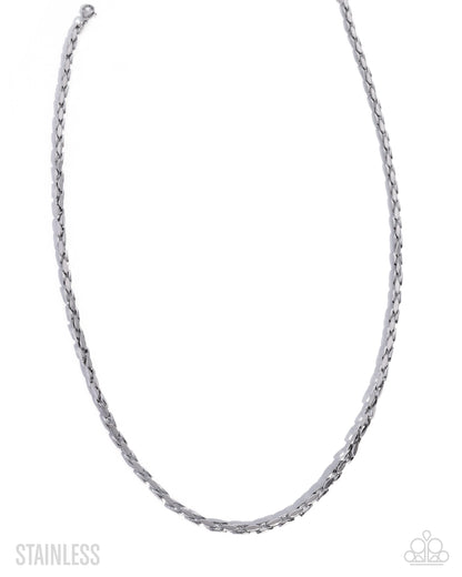 Silver chain necklace on a white background