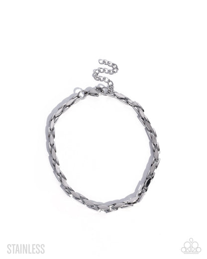 Silver bracelet on a white background with 'Stainless' text.