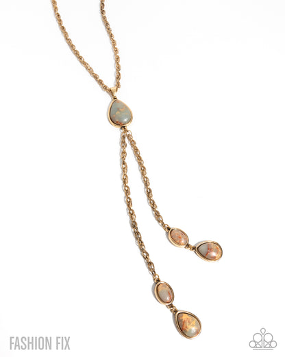 Rose gold necklace with opal-like stones on a white background