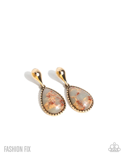 Pair of gold and stone earrings on a white background
