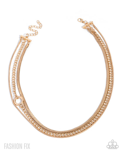 Gold chain necklace on a white background with 'Fashion Fix' branding.