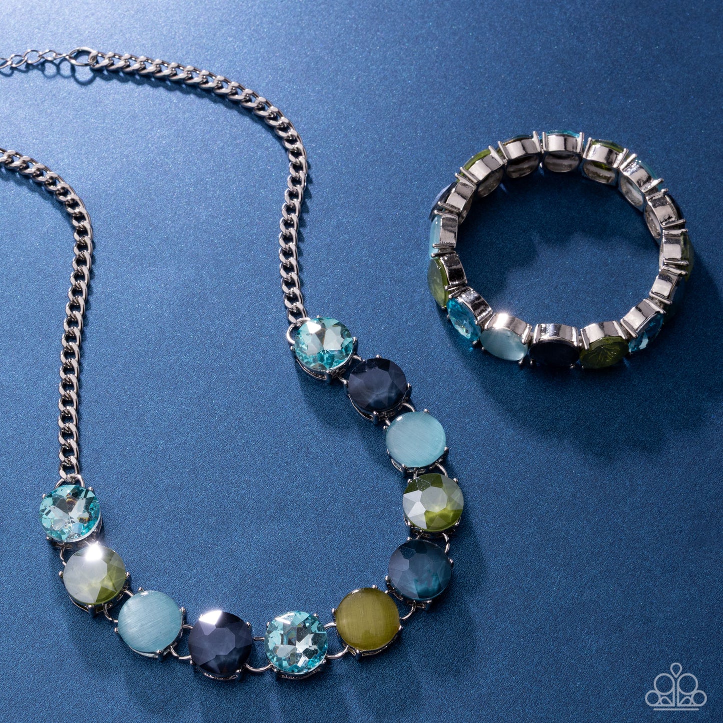 Jewelry set with necklace and bracelet on a blue background