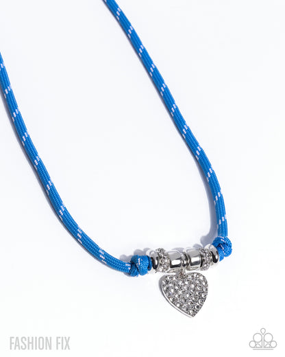 Blue braided necklace with a silver heart charm on a white background