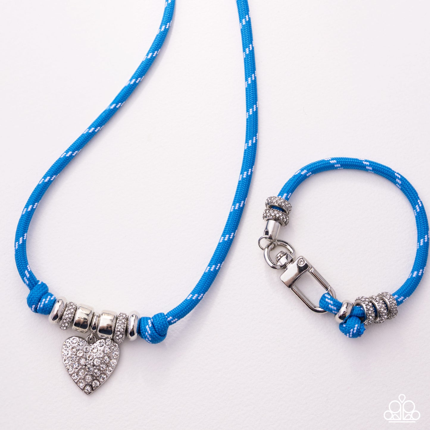Blue rope necklace with silver heart charm and clasp on a white background