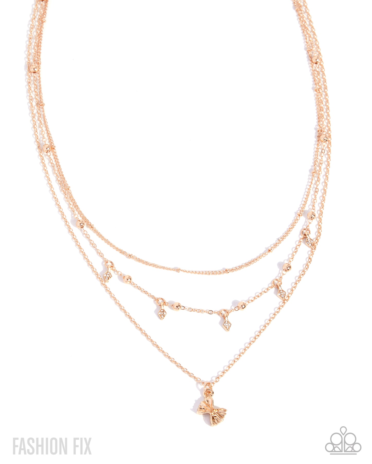 A rose gold multi-layered necklace with delicate chains, small bead accents, and a butterfly pendant, shown on a white background with 'FASHION FIX' text in the corner.