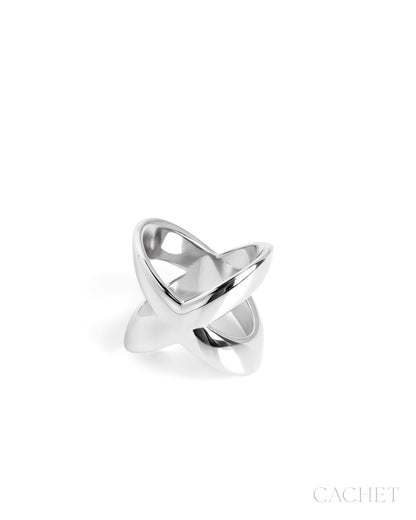 Silver ring with a unique design on a white background, branded 'Cachet'.