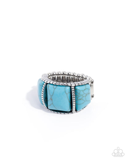 Turquoise ring with silver band on a white background